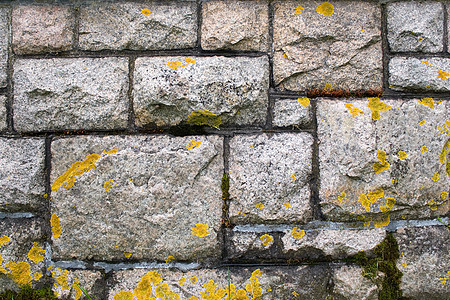 旧石墙岩石石头风化历史苔藓水泥建筑砖块材料灰色图片