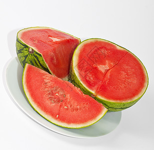 盘子上和白背景上的西瓜片食物白色营养西瓜烹饪水果生活背景图片