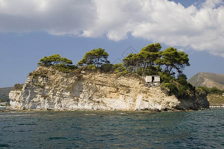 希腊风景岩石国家蓝色天空避暑胜地海岸线旅行目的地阳光图片