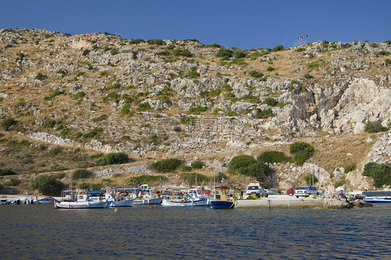 希腊海岸线风景旅游蓝色绿色石灰石异国场景阳光目的地图片