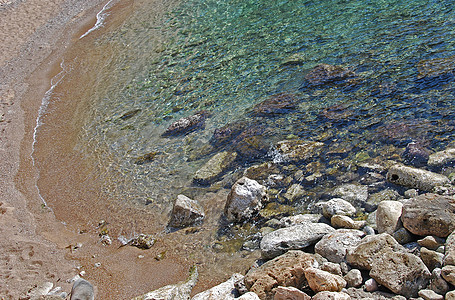 海岸线海浪巨石热带卵石海滩绿色假期蓝色叶子气候图片