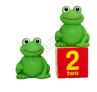 两只青蛙绿色玩具塑料动物爬虫眼睛白色橙子好奇心爬行动物图片