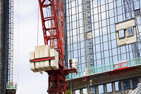 建造摩天大楼住房公寓项目水泥房子开发商蓝色加载起重机窗户图片