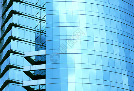 现代摩天大楼蓝色玻璃墙市中心企业大厦财产建筑经济办公室商业孤独窗户图片