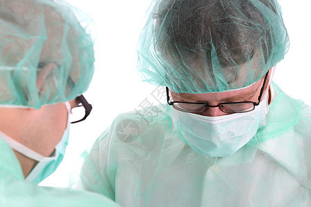两名外科医生在工作手术医院保健外套工人病人截肢面具助手疾病图片