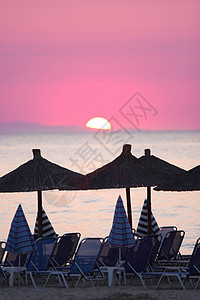 希腊的海洋和日出天气旅游热带金子阳伞日光旅行假期阳光日落图片