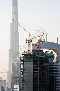 迪拜市风景情调闲暇酒店建筑物沙漠热带奢华城市起重机摩天大楼图片