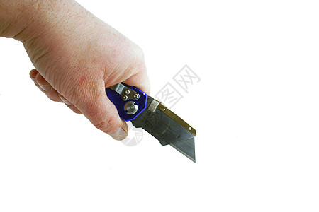 使用蓝色碘化承包商用刀的手图片