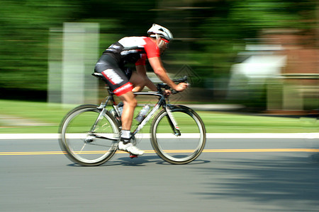 模糊运动自行车赛自行车竞争速度运动行动男性街道运动员活动旅游图片