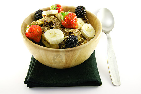 碗中的布兰花勺子餐巾饮食纤维活力早餐宏观薄片麸片小麦图片