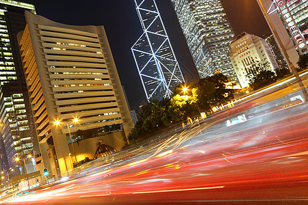 晚上在香港街道灯泡银行建筑物高楼交通摩天大楼高峰带子小时图片