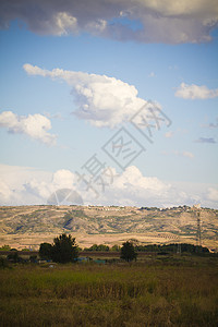 日落时的风景 西班牙语农村草地场地国家阳光土地草原农场天堂蓝色地平线图片