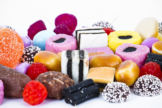 白背景上有很多糖果 鲜花零食花絮催肥橡皮糖便利牙龈幸福巧克力甜点糖衣果味图片
