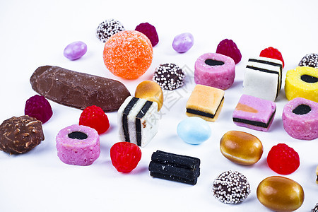 白背景上有很多糖果 鲜花零食橡皮糖团体派对甜点牙龈水晶花絮多样性便利催肥图片