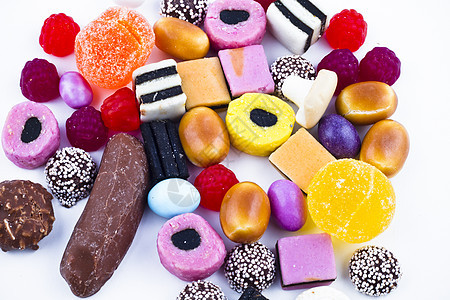 白背景上有很多糖果 鲜花零食催肥食物巧克力焦糖牙龈多样性便利果味派对水晶图片