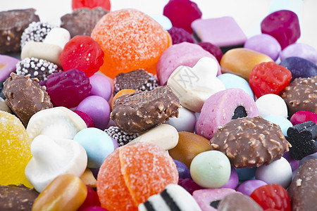 白背景上有很多糖果 鲜花零食派对团体水晶幸福花絮食物糖衣催肥甜点焦糖图片