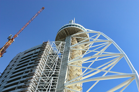 建筑工地蓝色财产工作脚手架水泥建筑物两极工业项目城市图片