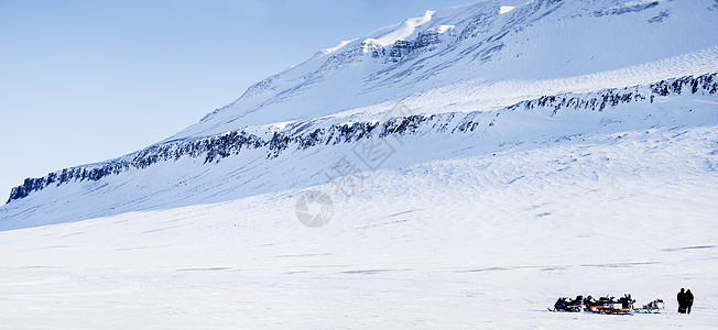 斯诺移动冒险场景摩托车蓝色滑雪道风景旅游环境女士旅行地形图片