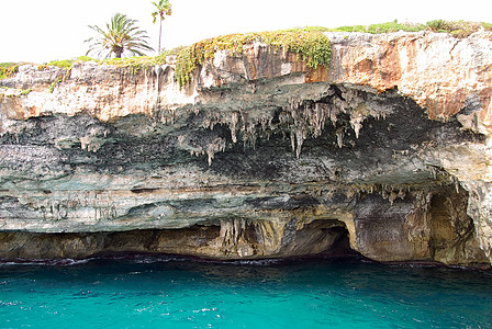 波多克里斯托附近海盗洞穴太阳石笋旅行钟乳假期海滩石洞海岸蓝色天空图片