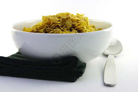 玉米片和勺子在碗中午餐牛奶玉米厨房饮食薄片蜂蜜食物谷物小吃图片