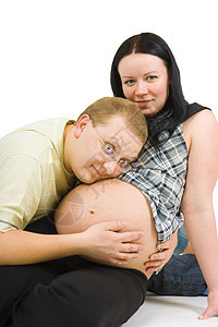 年轻家庭男人父母情感父亲夫妻婚姻腹部拥抱母性母亲图片