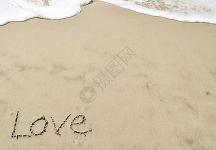 爱在沙沙中棕褐色海洋海浪泡沫写作图片