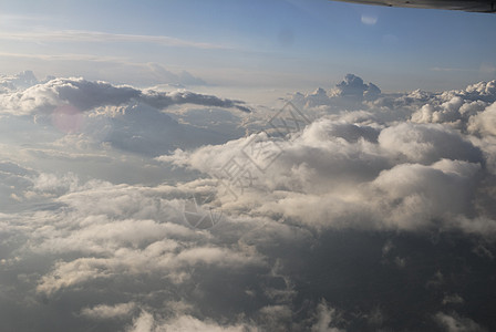 云飞行地平线鸟瞰图白色天空航班航空公司风景蓝色日落图片