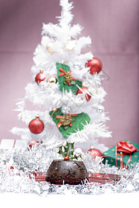 圣诞节布丁糖浆庆典香料杏子装饰品水果葡萄干甜点派对坚果背景图片