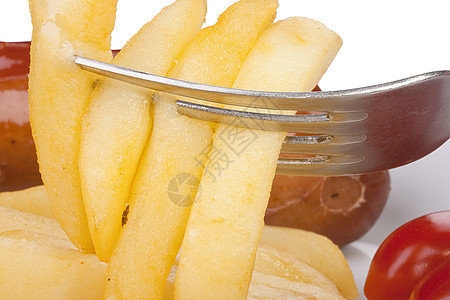 叉子上炸薯条别针白色油炸粉色食物蔬菜营养黄色盘子工具图片