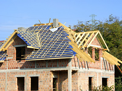 正在建造中的新住宅房蓝色天空隐藏勃起房子开发商建筑窗户图片