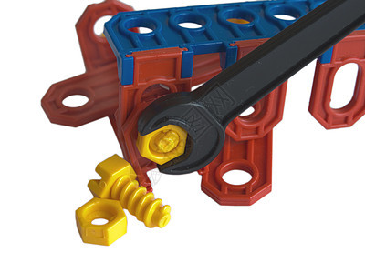 儿童玩具的彩色细节孩子白色扳手维修工业塑料黄色红色坚果指甲图片