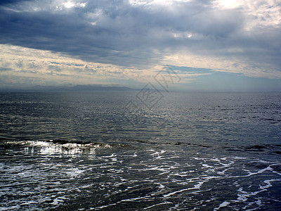 太平洋反射海岸线天空海浪假期蓝色海景地平线旅行太阳图片