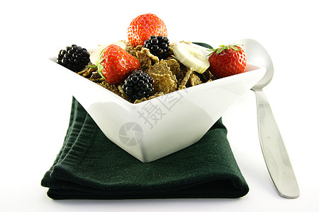 白碗中的布兰花饮食勺子小吃薄片餐巾福利小麦牛奶早餐宏观图片