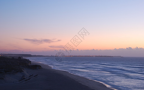 葡萄牙的多彩日落阳光热带反射海岸海景天气海洋橙子地平线海岸线图片