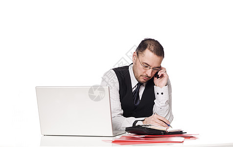 男人在桌子后面组织自己的一天电话写字桌瓶子日记白色笔记本讲坛电源簿领带秘书图片