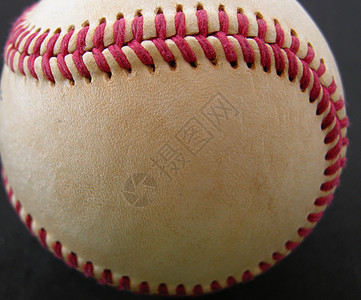 垒球皮革白色缝线沥青黑色红色运动游戏圆形图片