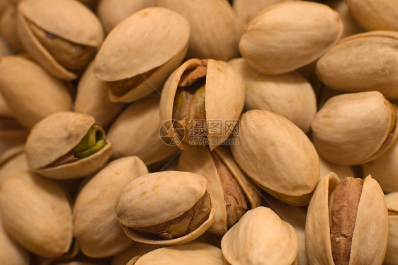 Pistachios 螺旋藻植物小吃盐渍坚果团体食物种子水果市场绿色图片