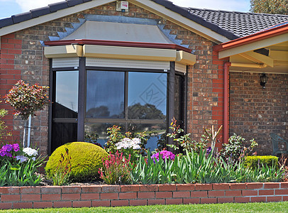 澳大利亚家庭住房 外墙外面绿化石头入口海滩阳光院子奢华晴天花朵房子图片