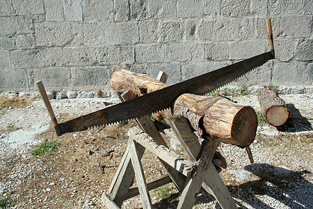 锯子烘干工具工业粮食森林树干日志林业记录柴堆图片