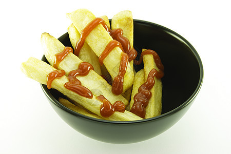 黑碗的弗莱斯水平午餐土豆餐厅筹码营养红色脂肪油炸薯条图片