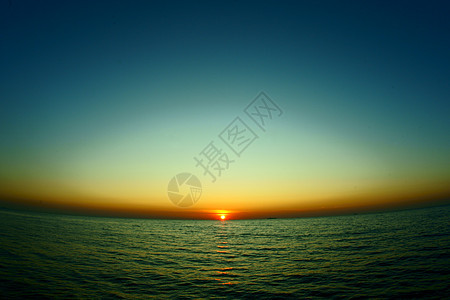 日落海岸线橙子海浪热带海洋气氛假期阳光季节蓝色图片