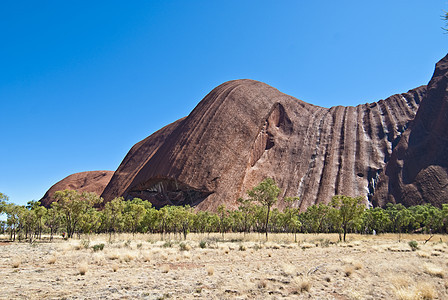 2009年8月 澳大利亚北部地区Ayers Rock领土土著橙子蓝色太阳荒野山脉巨石农村衬套图片