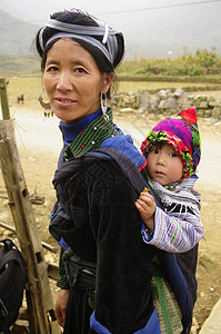 黑人苗族妇女及婴儿风俗民间少数民族多样性戏服女士发型珠宝耳环衣服背景图片