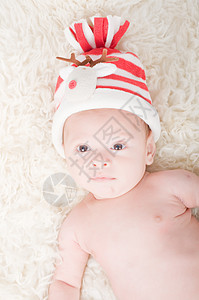 戴着礼服帽的新生儿条纹新生帽子孩子衣服毛皮童年男生婴儿材料图片