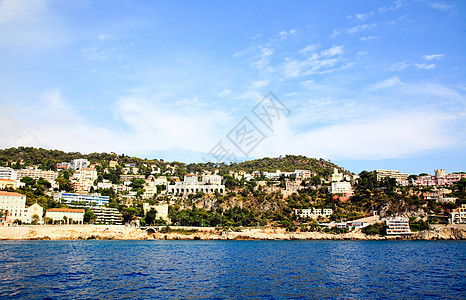 亿万富翁在尼斯海滩前线的房子港口游艇黄色城市桅杆天空假期晴天旅行图片