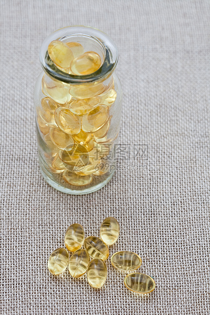 鳕鱼肝油囊营养黄色麻布食物胶囊玻璃材料饮食图片