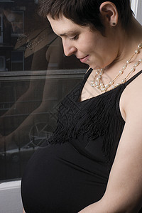 怀孕女性木乃伊女士腹部母亲家庭冲孔孩子首饰微笑图片