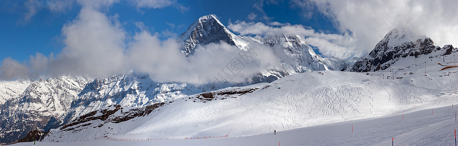 爱热滑雪者地形滑雪阴影房子闲暇蓝色高地冰川阳光图片