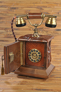 孤立的旧式电话耳机铃声旋转乡愁钥匙数字棕色管子褐色通讯图片