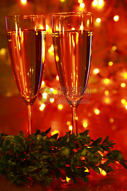 带绿色树枝的香槟杯周年枝条生日玻璃餐厅人生派对盒子背景大事图片